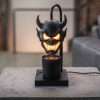 Black horned demon head shade glowing over a jar candle on a square base, GODONLIF Halloween candle warmer lamp