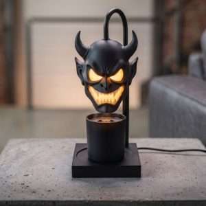 Black horned demon head shade glowing over a jar candle on a square base, GODONLIF Halloween candle warmer lamp