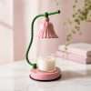 Glossy pink bell shade on a twisted green stem over a jar candle on a pink base, the GODONLIF pink candle warmer lamp