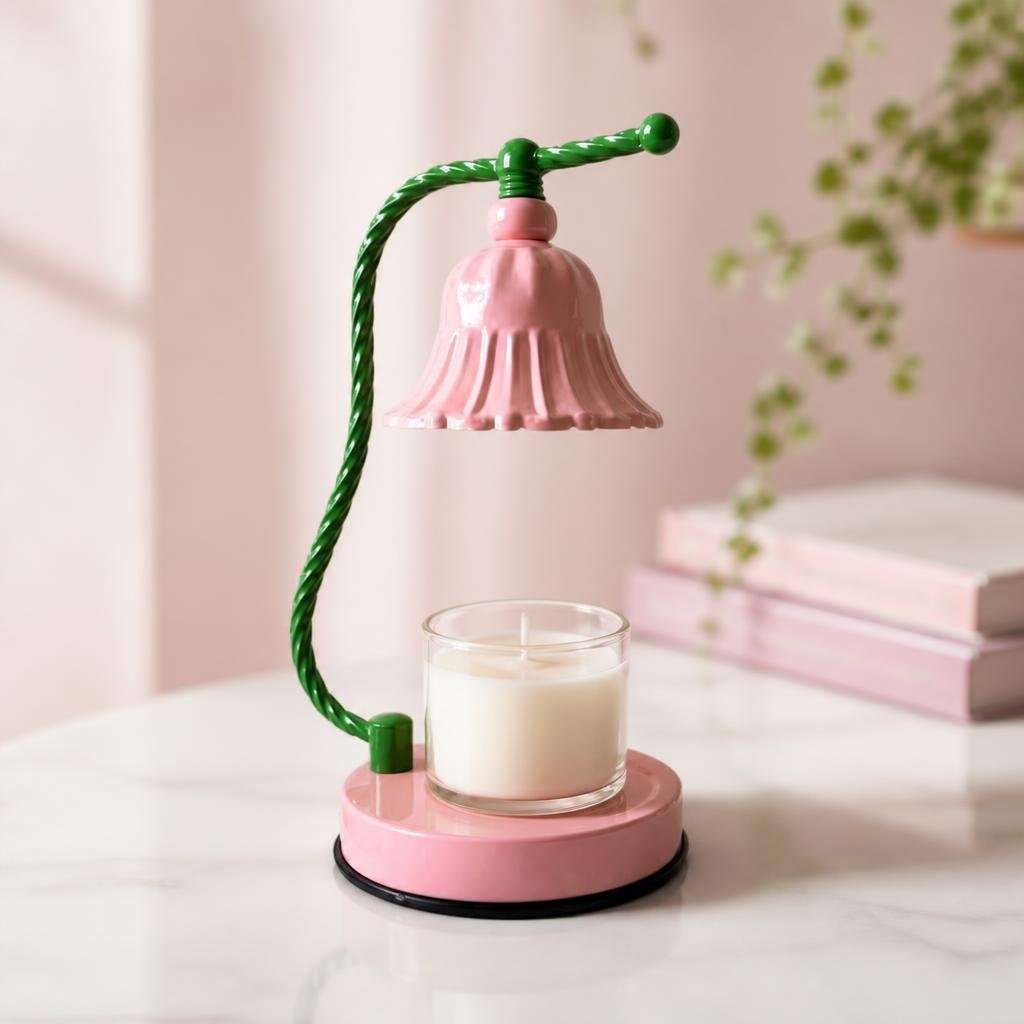 Glossy pink bell shade on a twisted green stem over a jar candle on a pink base, the GODONLIF pink candle warmer lamp