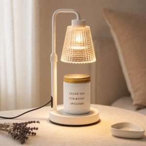 GODONLIF lavender soy candle jar on an ivory white candle warmer lamp with dried lavender
