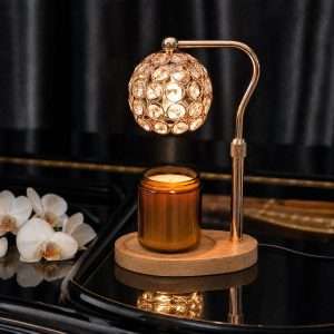 Beaded crystal globe shade lit over an amber jar candle on a wood base, the GODONLIF crystal candle warmer lamp