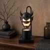 Black horned demon head with glowing eyes over a jar candle on a square base, the GODONLIF halloween candle warmer