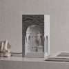 The same niche lamp switched off, showing the grey stone face and the white David figure, one of our plaster lamps
