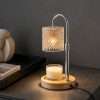 Faceted cut glass shade glowing over a jar candle on a round wood base, the GODONLIF adjustable height candle warmer
