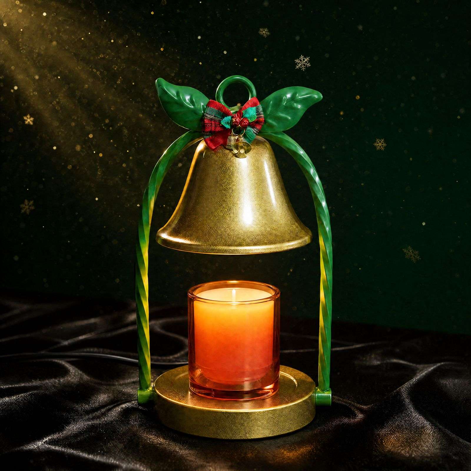Close-up of the lit gold bell on black satin against a dark green backdrop with gold snowflakes, Christmas bell decor