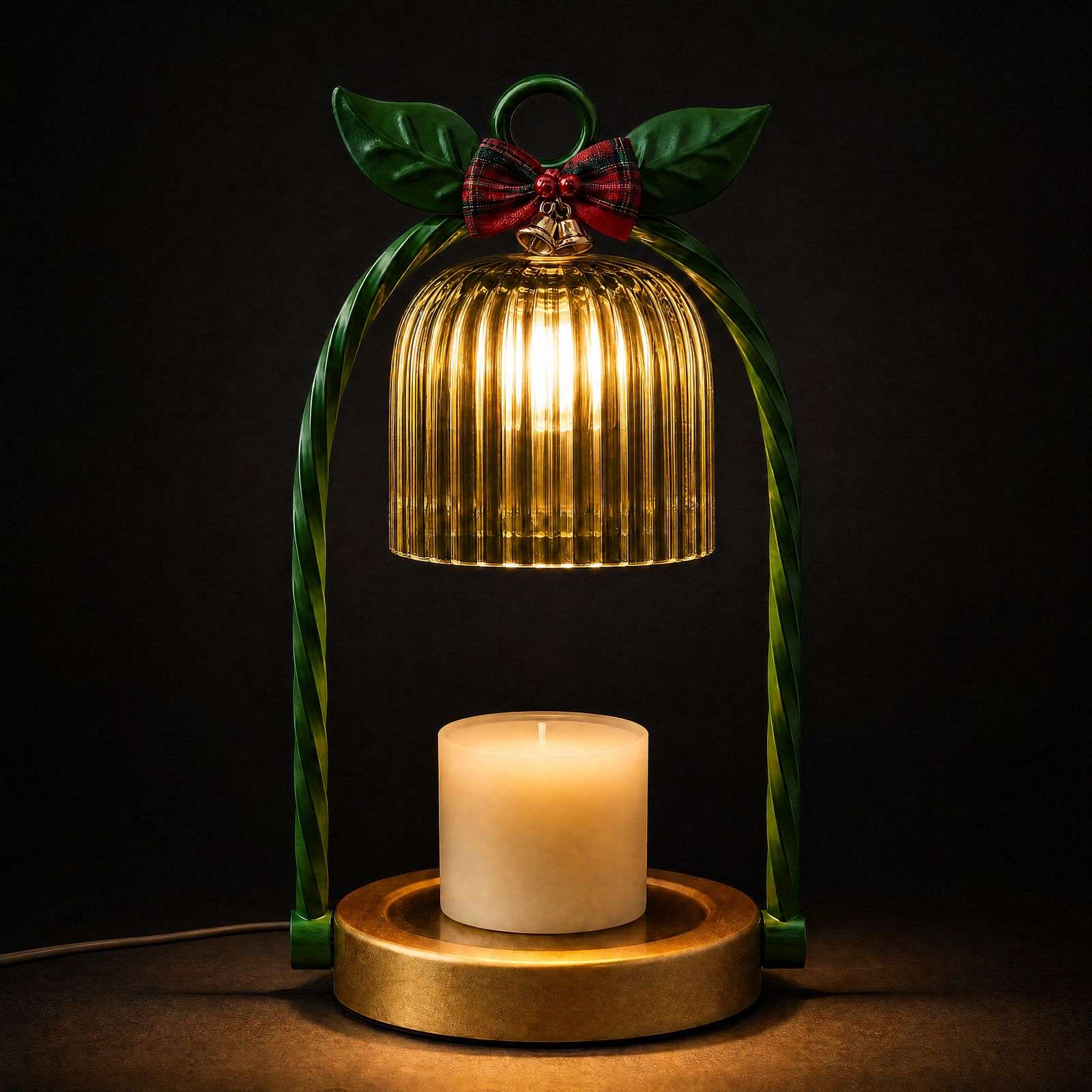 Green wax warmer glowing against a dark studio wall, ribbed bell shade over an unlit pillar candle