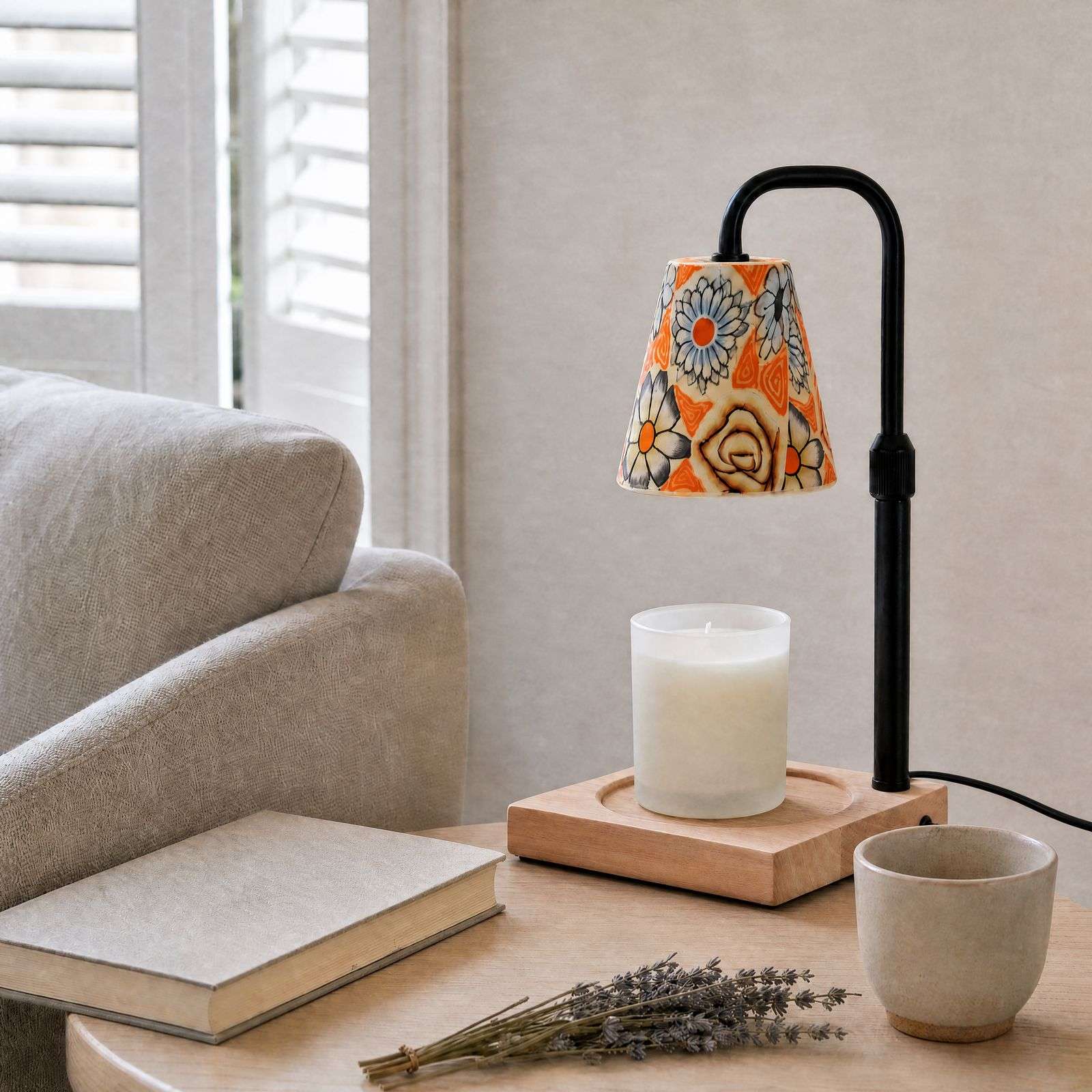 Unlit cone shade, one of our hand painted lamp shades, on a black arm over a white jar candle