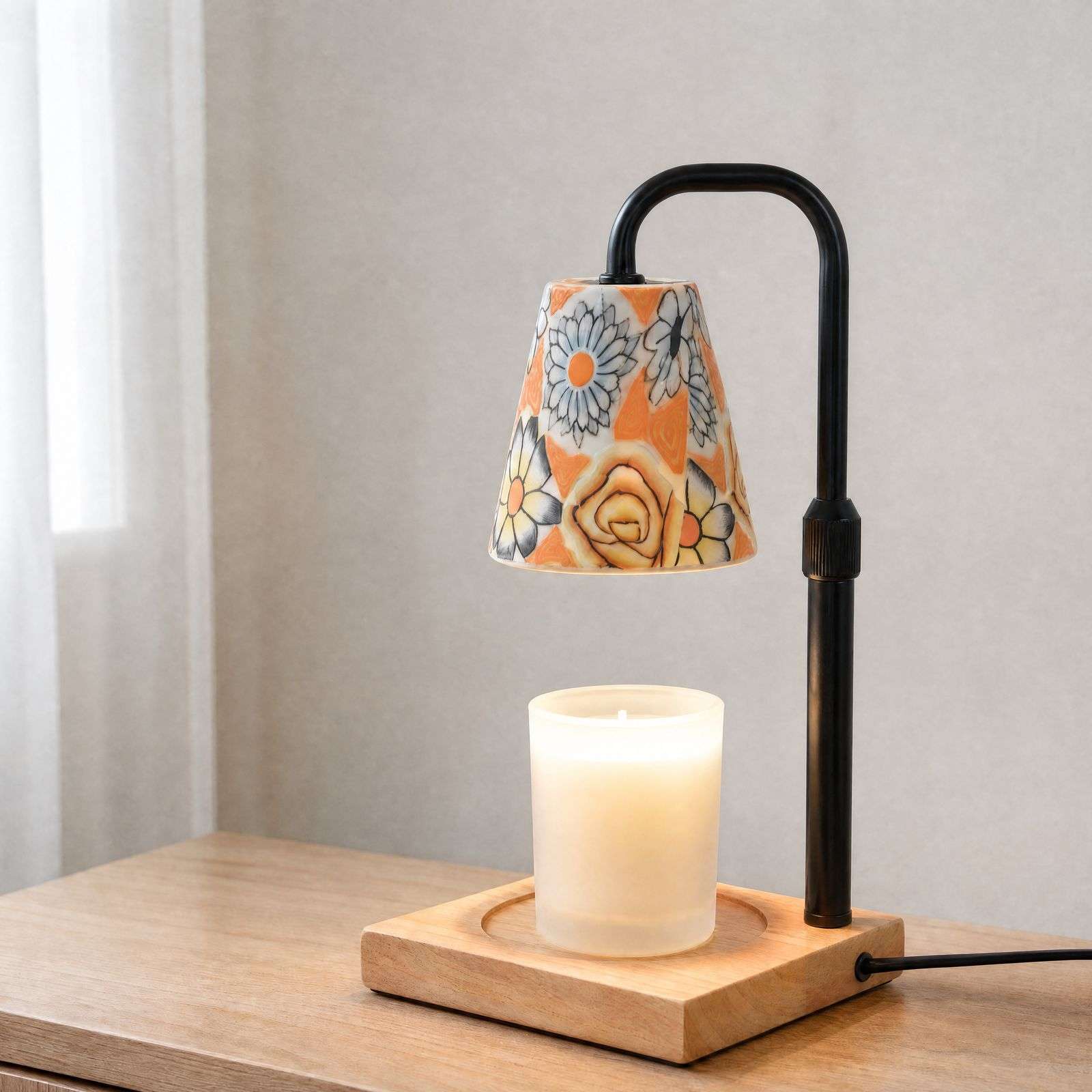 Angled view of the ceramic warmer lamp on a wood dresser, cottagecore home decor with painted daisies