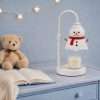 The same snowman candle lamp switched off, showing the frosted shade, red scarf, twig arms and the jar candle below